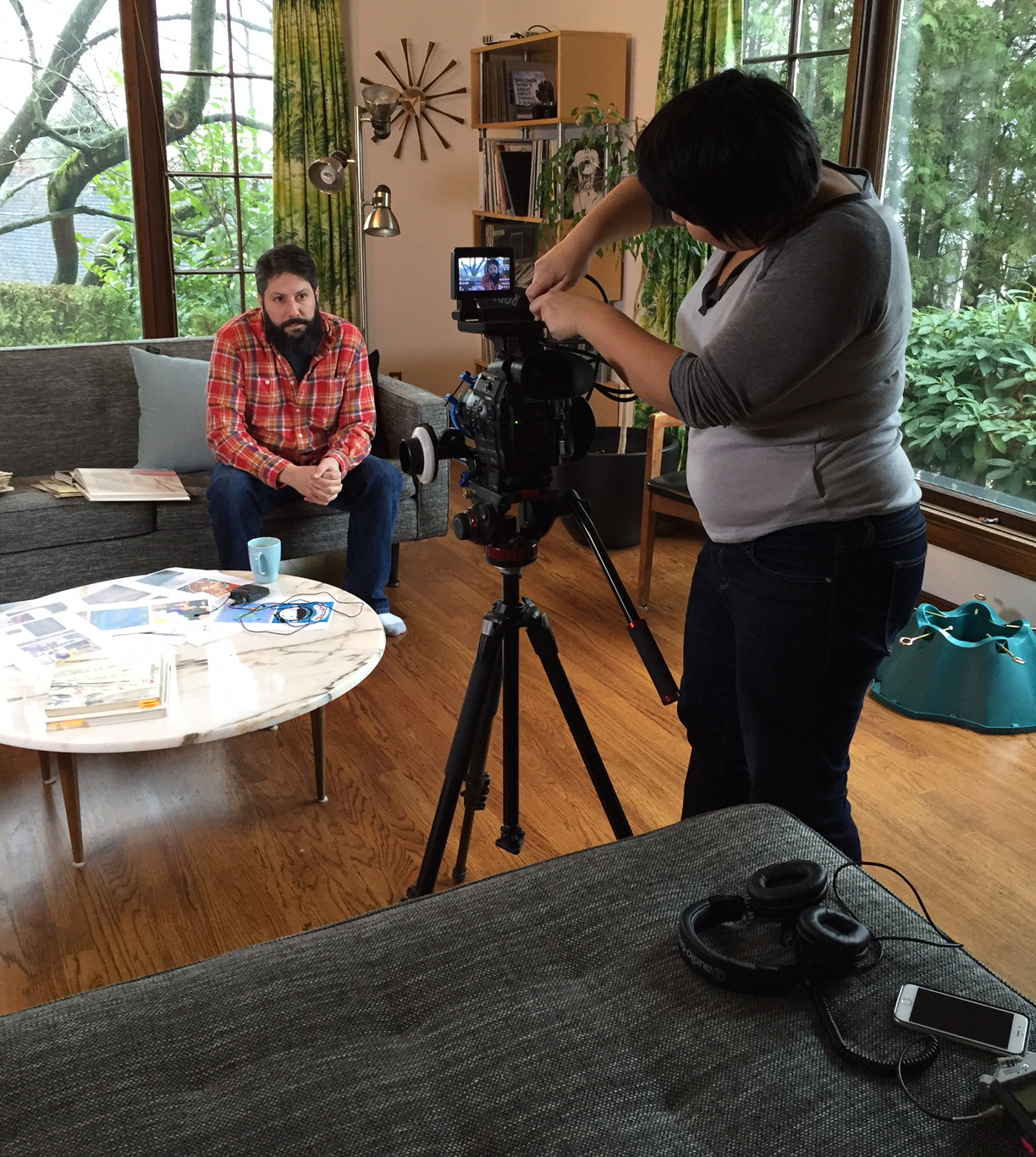 Dawn prepares the camera while Pat waits patiently, despite having loads of work to do in this busy season for his business, Buy Olympia.