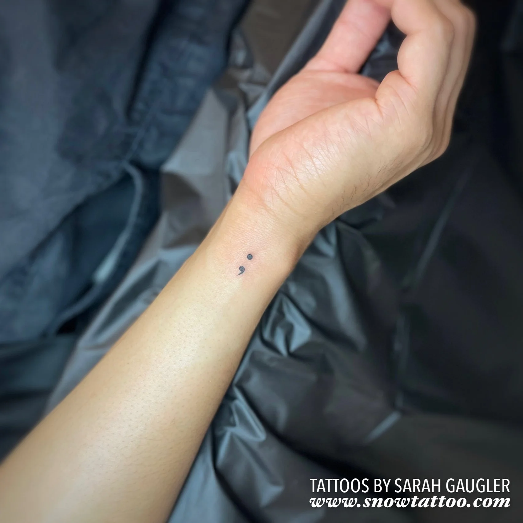 Dainty Elegant Mini Semicolon Tattoo by Sarah Gaugler at Snow Tattoo, Tribeca, New York