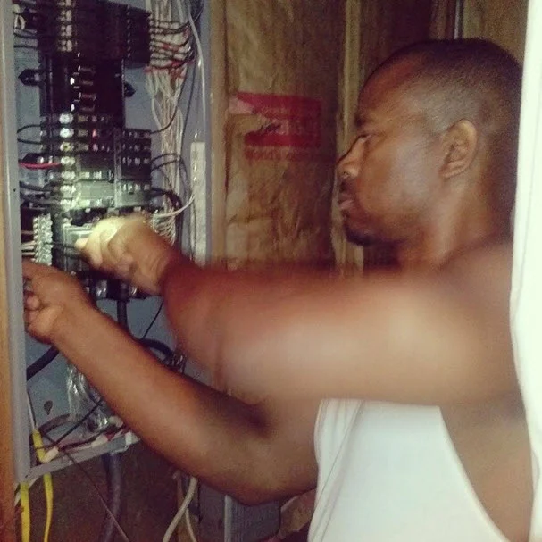 Travis wiring my electric work in my studio.