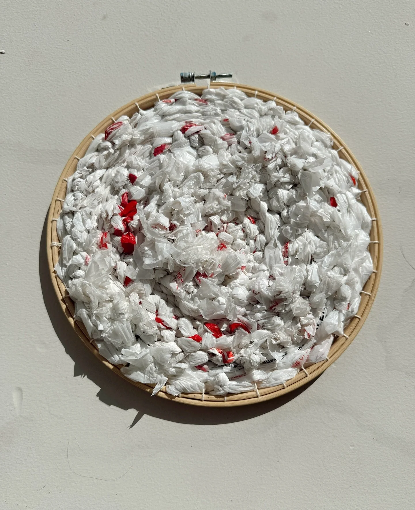 &ldquo;23 Grocery Bags&rdquo; and &ldquo;27 Grocery Bags&rdquo; - a pair of round weavings made of (you guessed it) strips of 50 total recycled plastic grocery shopping bags. These were made for the Earth Day Recycle Omaha group exhibition, in conjun