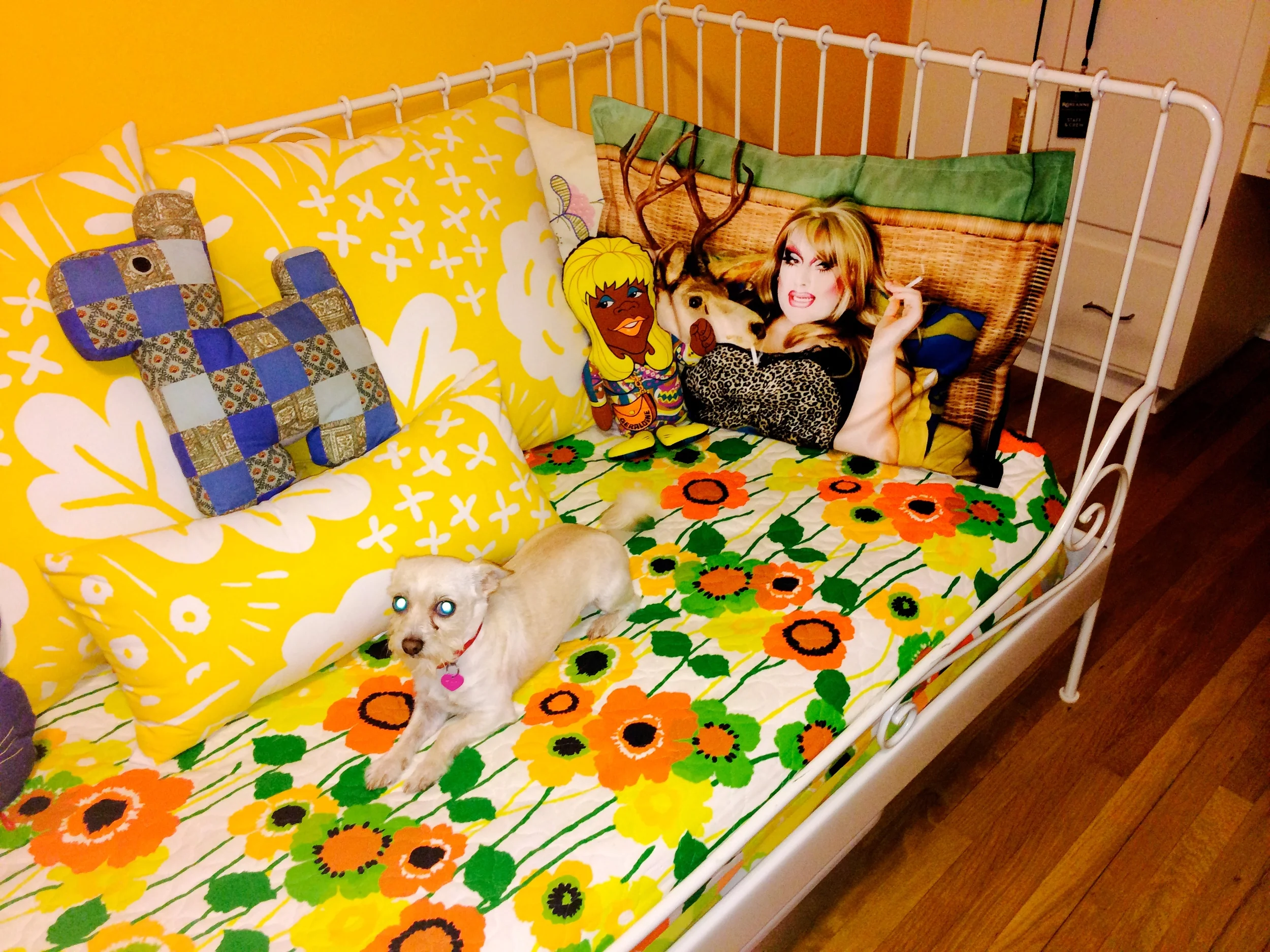 Notice the Jackie in bed with deer and her adorable pooch who only has Satan eyes in this picture.