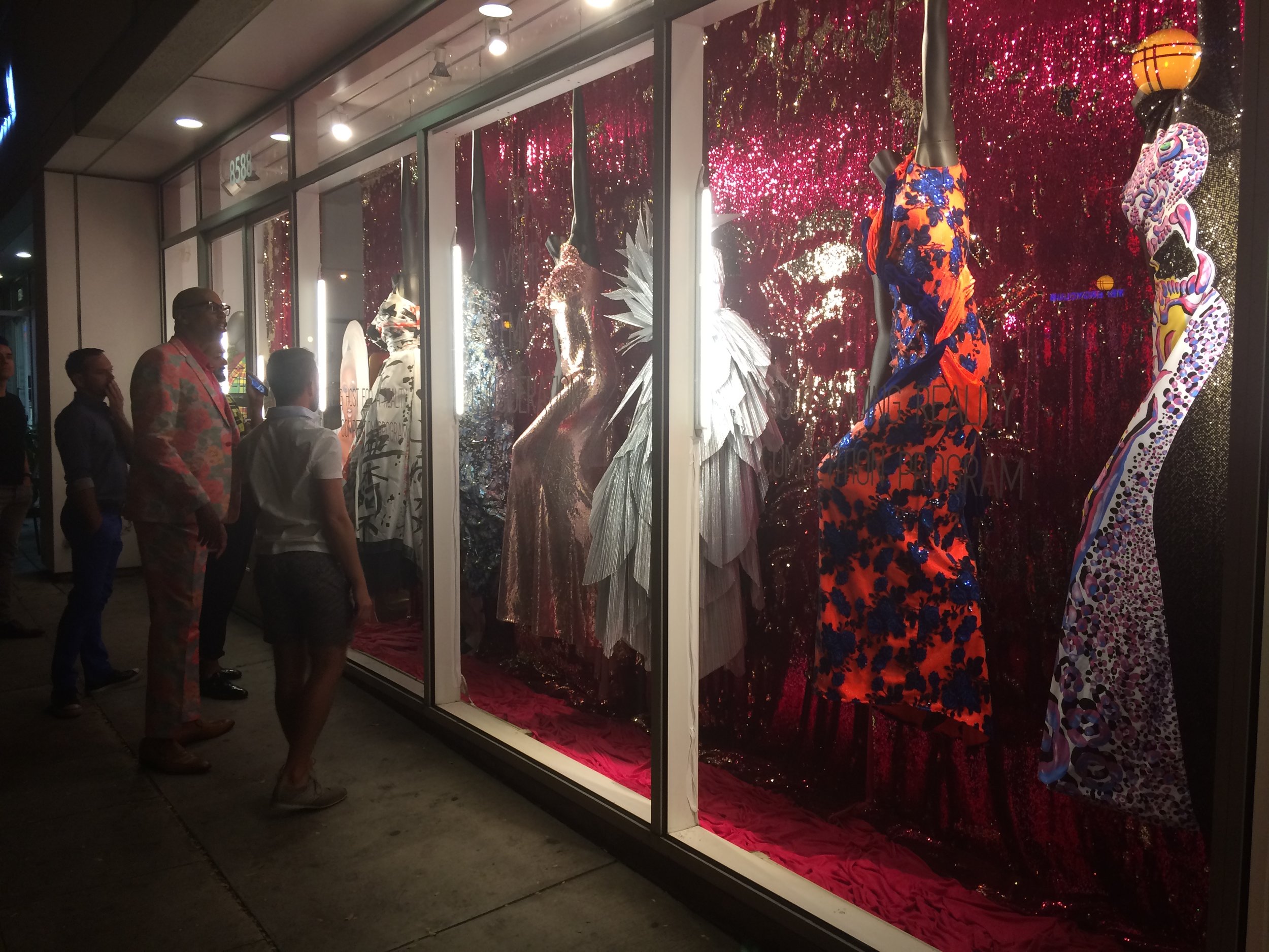 RuPaul checks out the window display of his Drag Race dresses
