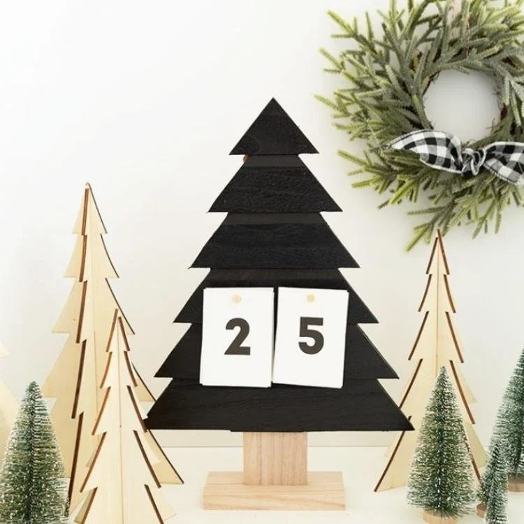 black wooden tree advent calendar with the number twenty-five on