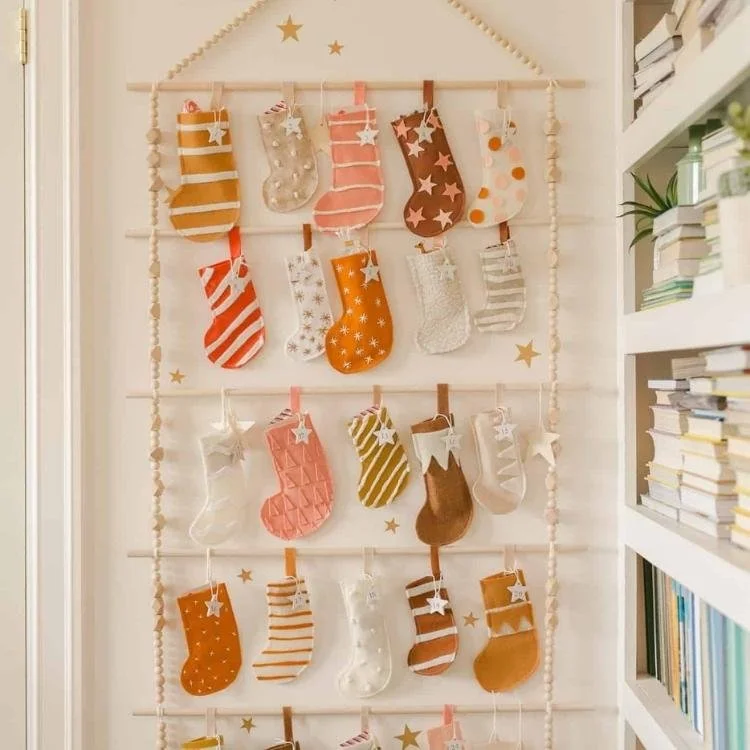orange and brown felt stockings hanging from wall