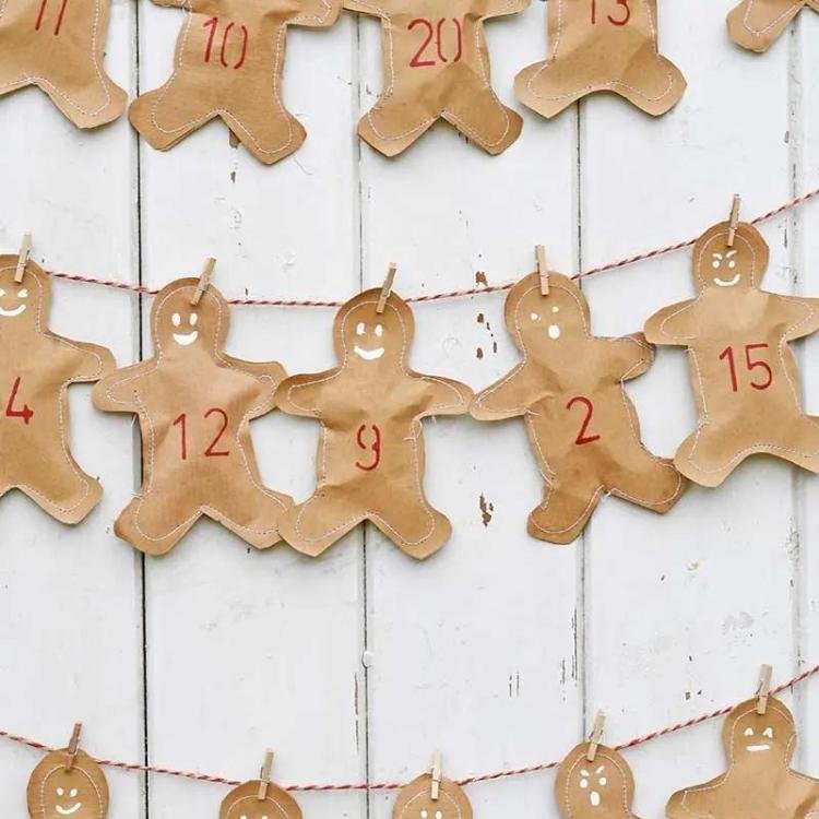 brown paper gingerbread men hanging from twine