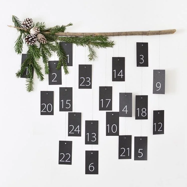 numbered envelopes hanging from branch