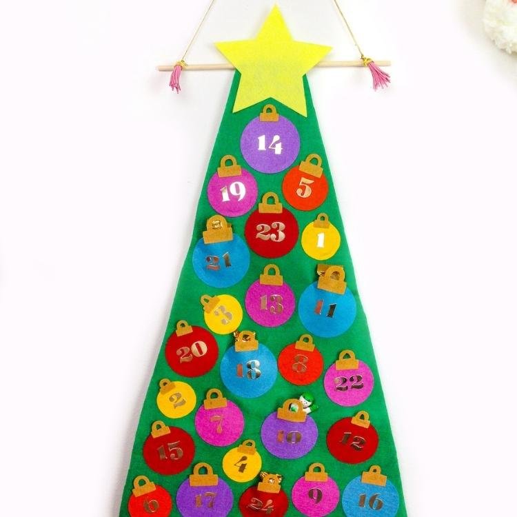 green felt tree covered in numbered felt baubles