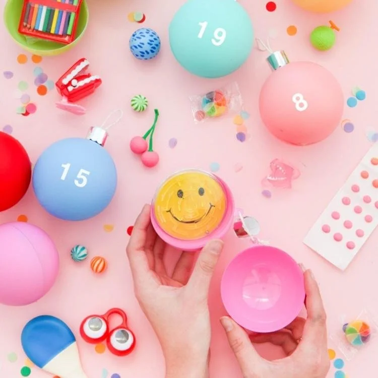 plastic balls with white numbers filled with small gifts