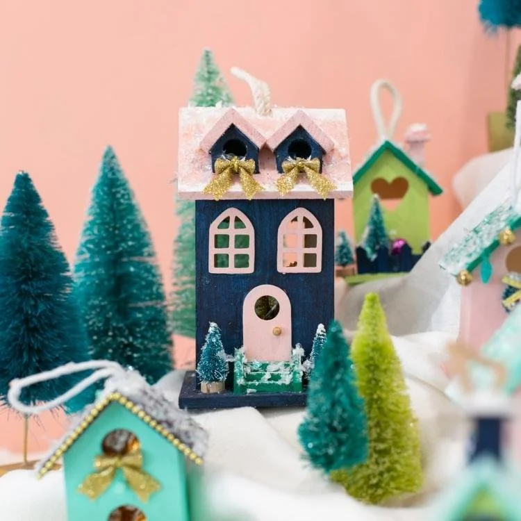 dark blue wooden house with pink roof, windows and door