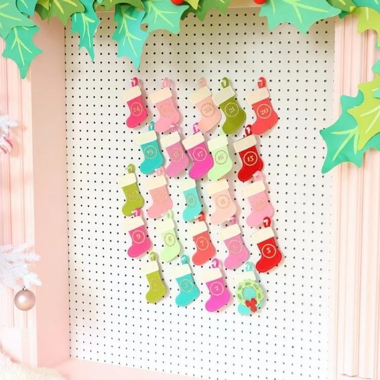 mini felt stockings hanging from pegboard