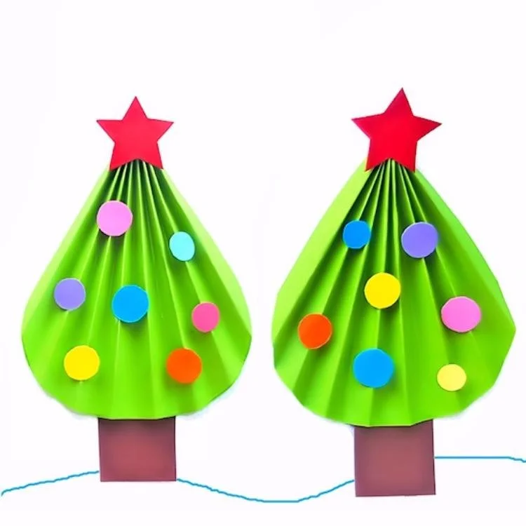 two green origami trees with red stars and coloured dots for baubles