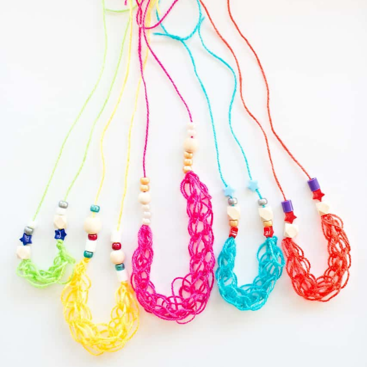 brightly coloured finger knit beaded necklaces in a row