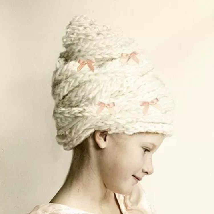 child wearing rococo style wig made out of wool