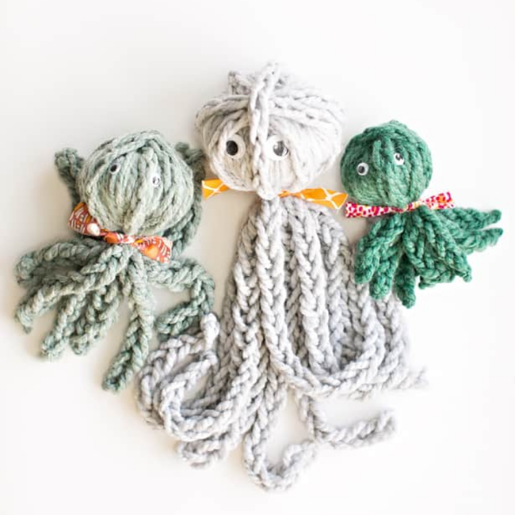 three knitted octopus in a row