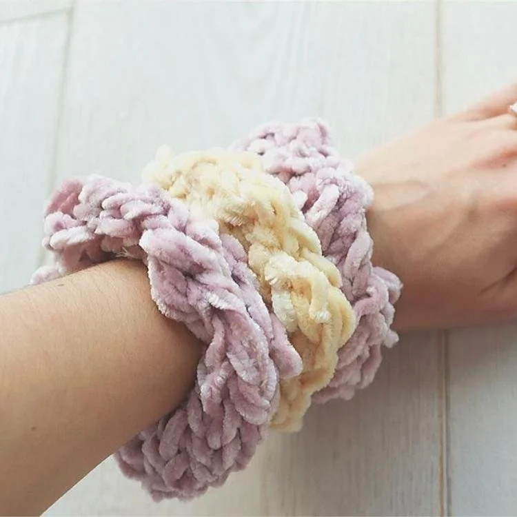 three scrunchie hair ties on wrist