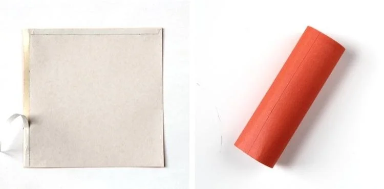 orange paper rolled up into a tube shape
