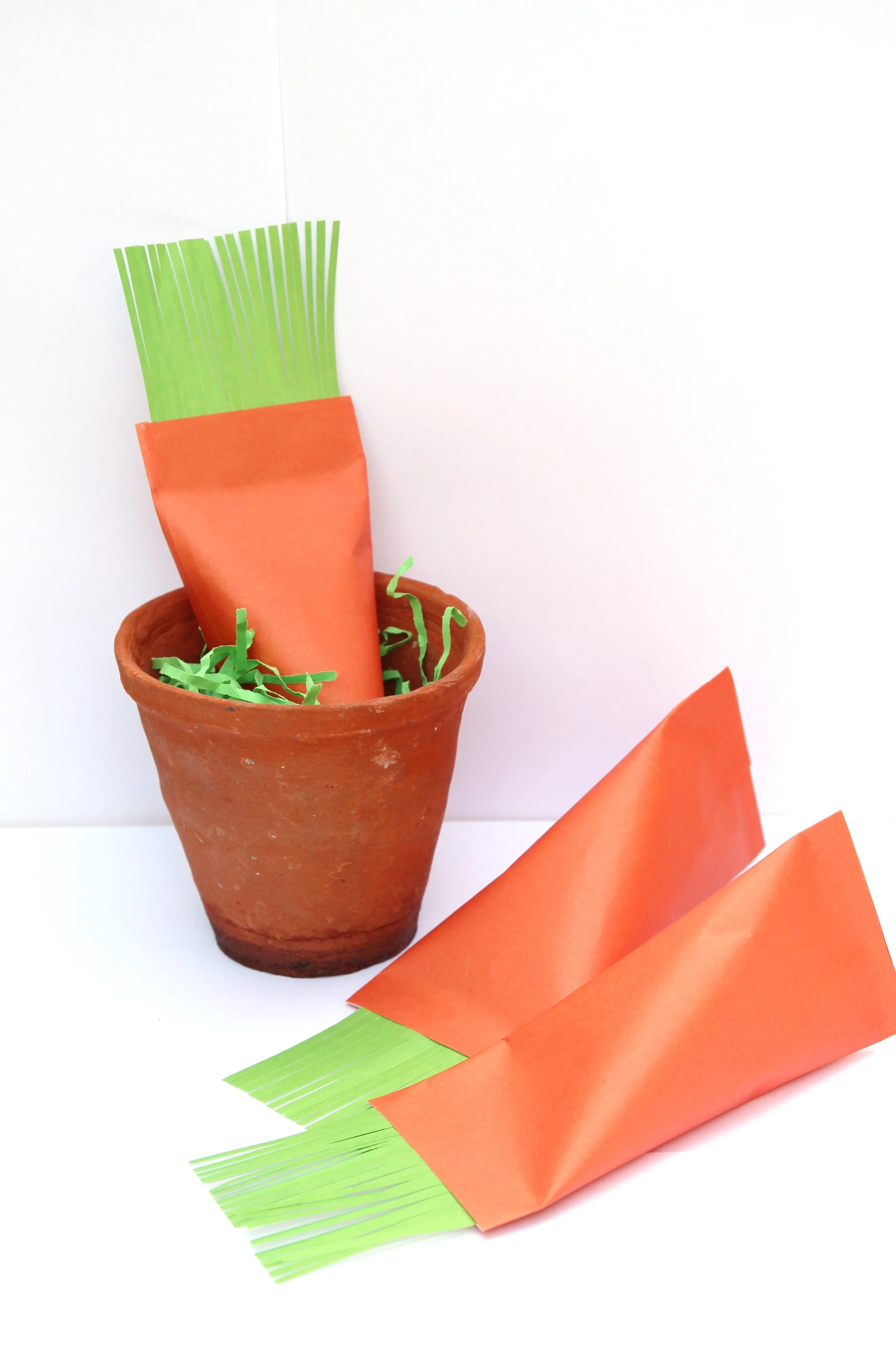 carrot paper treat box in small terracotta out with two more carrot boxes in front
