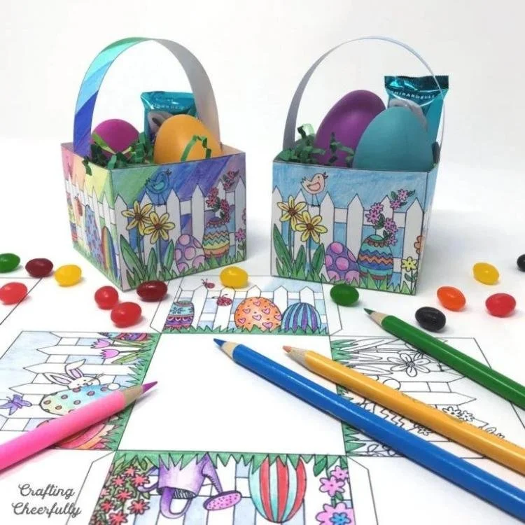 Printable colouring Easter baskets surrounded by coloured pencils and sweets.