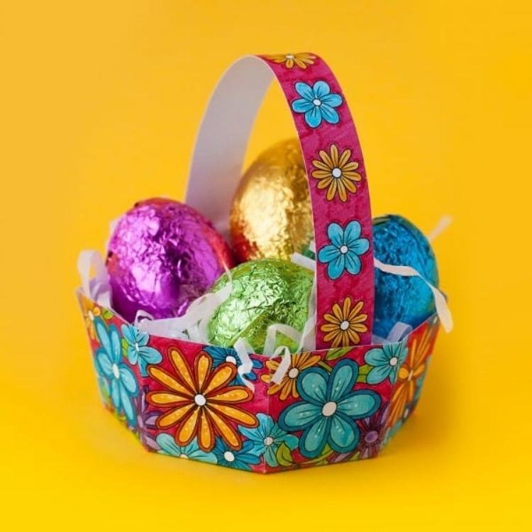 Printable Easter that has been coloured in filled with chocolate eggs.