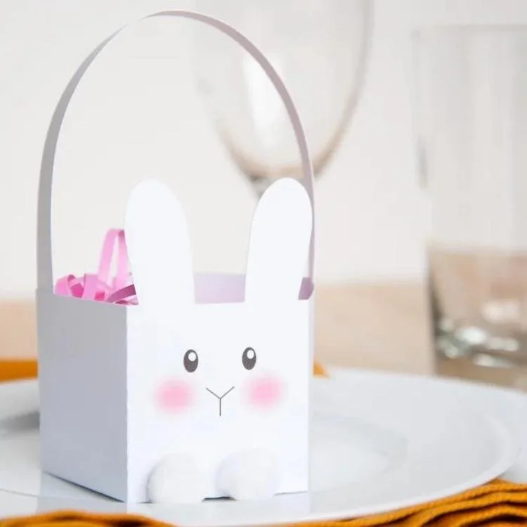 White Easter bunny basket with pom pom feet.