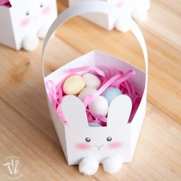 White pentagon shaped basket with bunny on it.