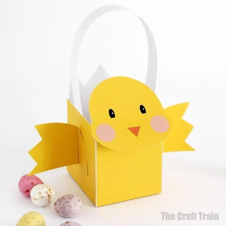 Yellow Easter basket with chick face and wings.