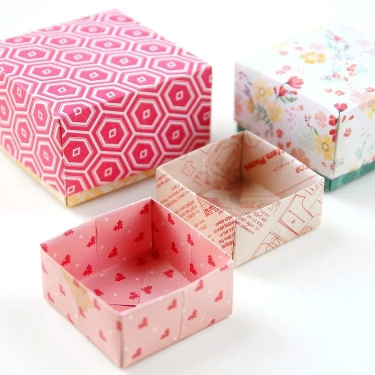Origami boxes on white background.