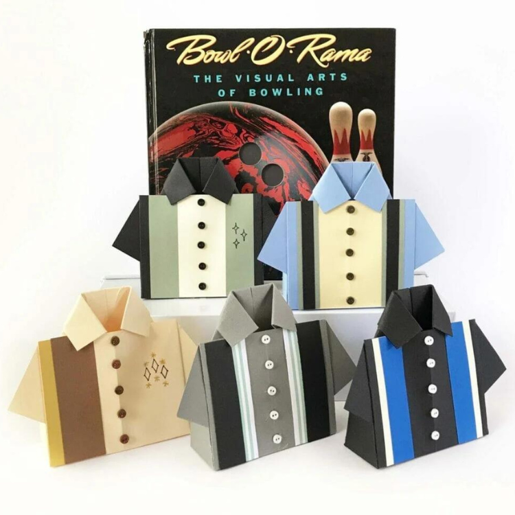 Five bowling shirt shaped gift boxes made out of paper.