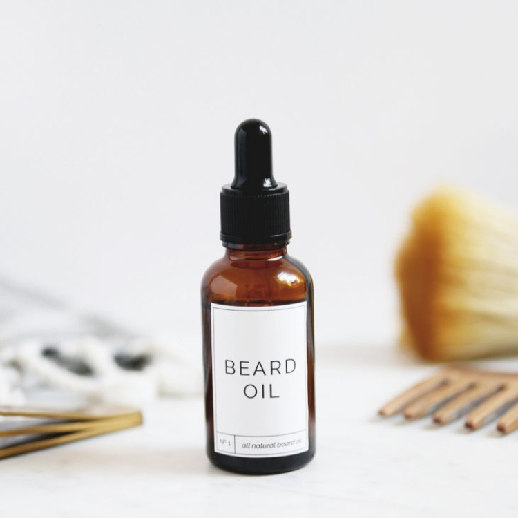 Glass bottle with beard oil label.