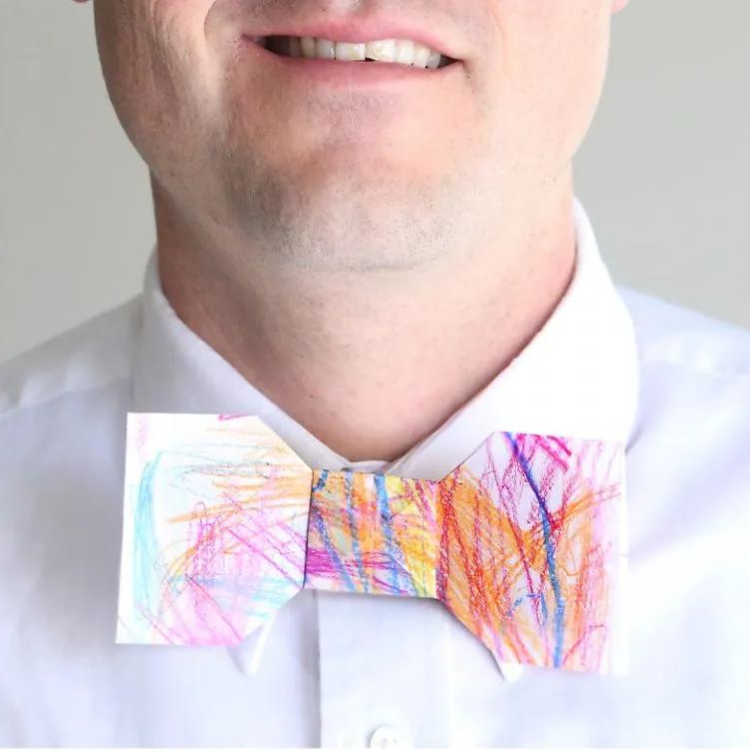 Man wearing origami paper bow tie.