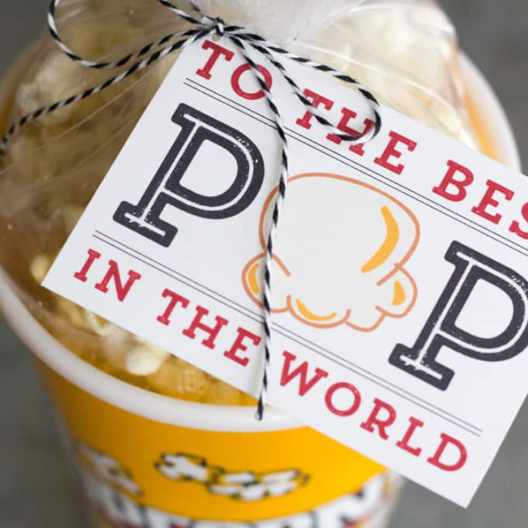 Gift tag ties to a cup of popcorn.