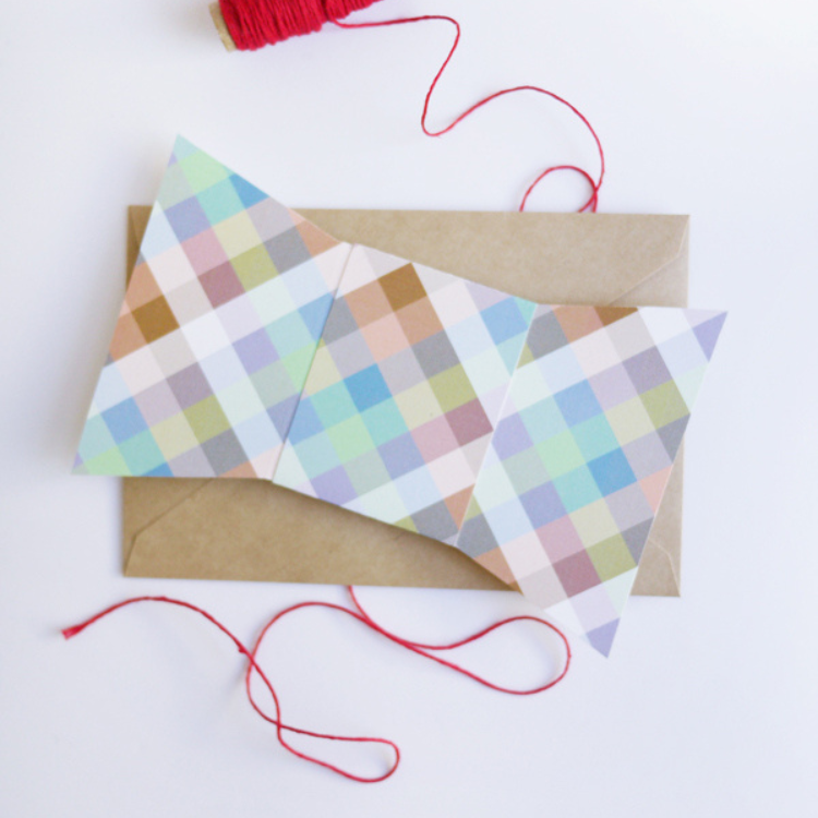 Gingham checked paper bow tie shaped card.