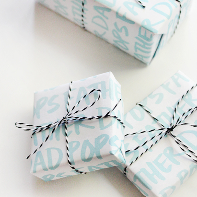 Small square gifts wrapped in white and blue printable gift wrap.