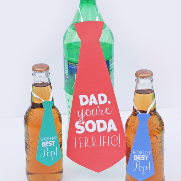 Soda pop bottles with tie shaped gift tags attached.