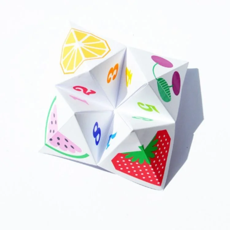 Origami fortune teller with fruit design.