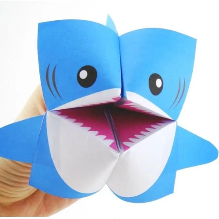 Blue paper origami shark.