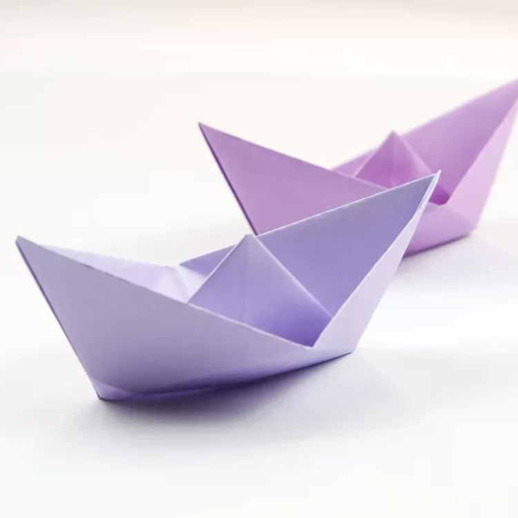 Two purple paper boats.