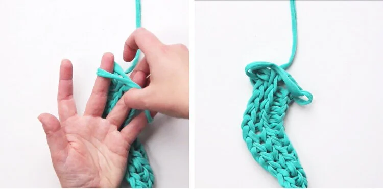 Finger knitting being removed from hand.