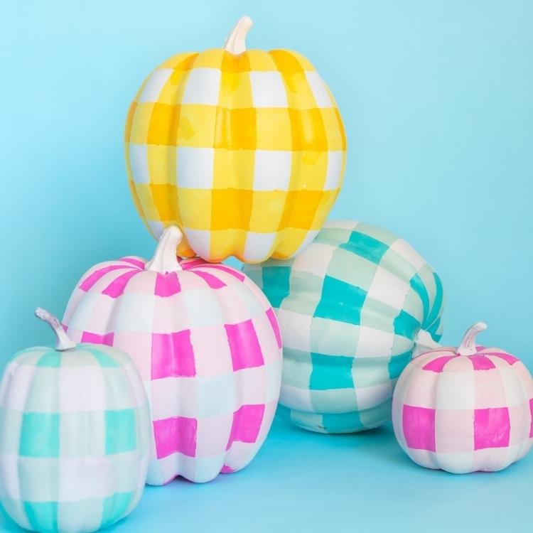Pink yellow and blue gingham painted white pumpkins.