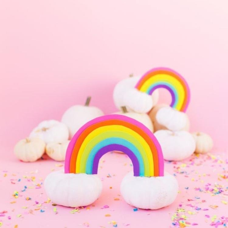 Two small white pumpkin clouds with rainbow.