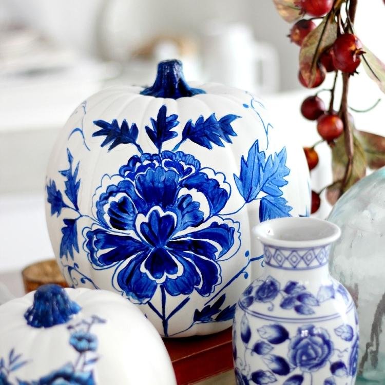 White pumpkin with blue floral painted pattern.