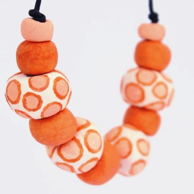 Close up of terracotta bead necklace.