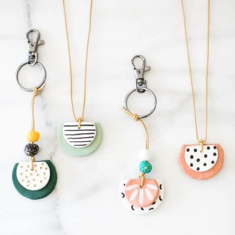 Selection of keyrings and necklaces made out of circles and semi circles.