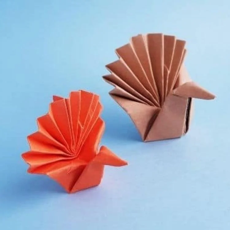 Orange and brown origami turkeys.