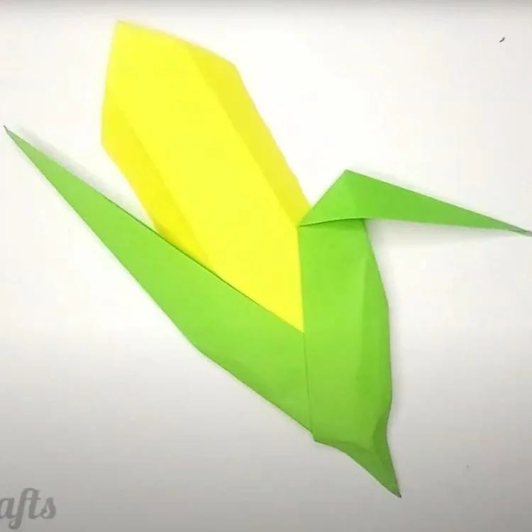 Origami corn made from green and yellow paper.