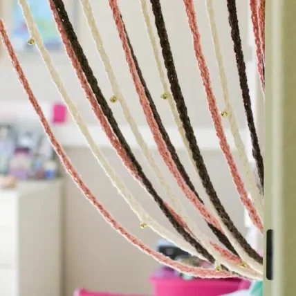 Finger knitted door curtain.