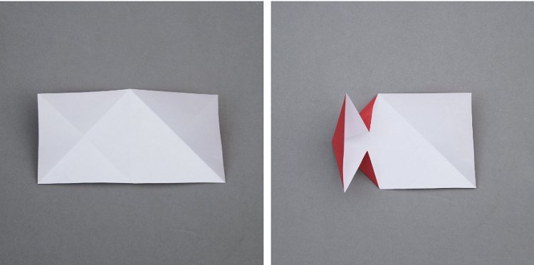 Piece of folded paper on grey background.