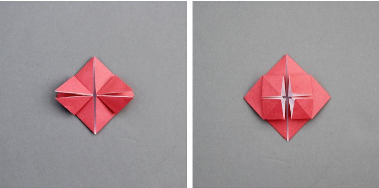 Red folded paper with small triangle flaps in the centre.