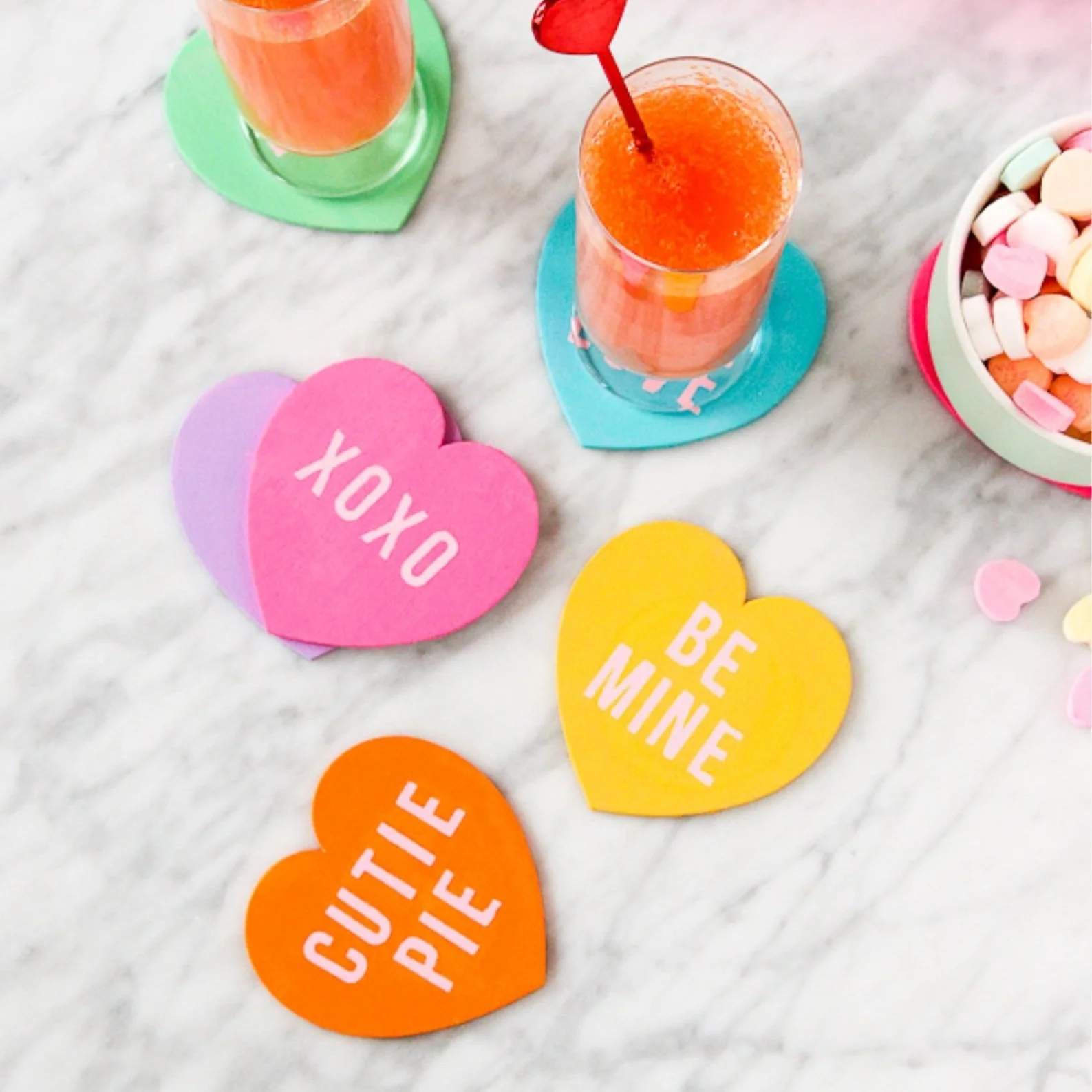 Heart shaped coasters on marble tabletop.
