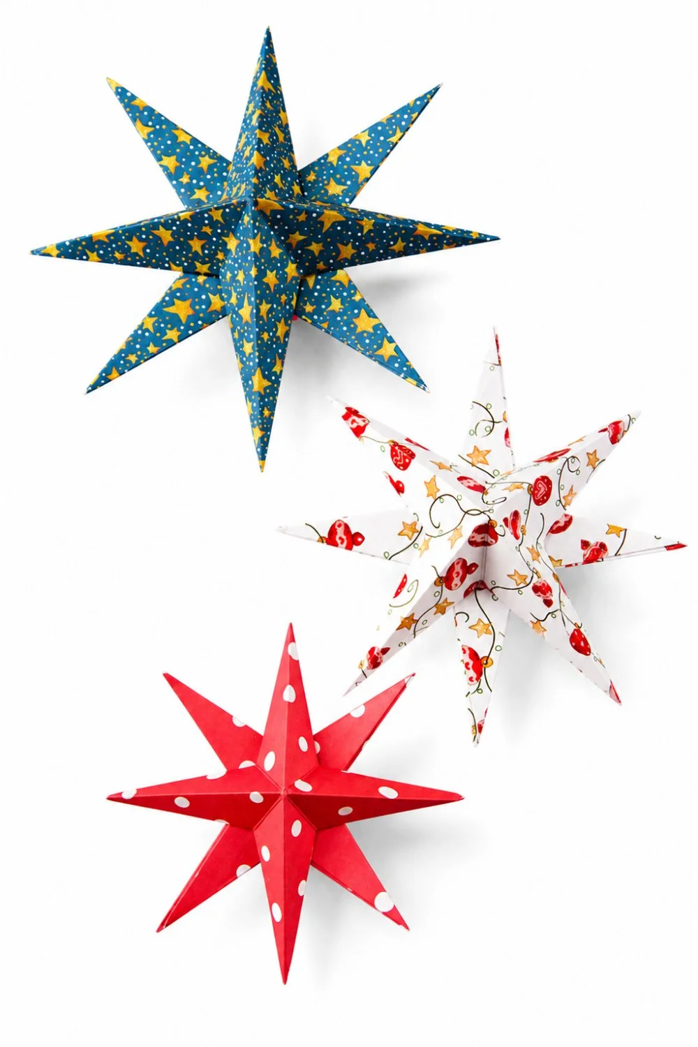 Three colourful 3D paper stars in red, blue and white scrapbook paper displayed on a white background.jpg